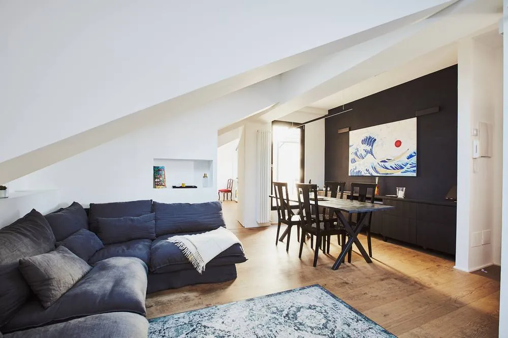 Open-plan loft living room with skylights