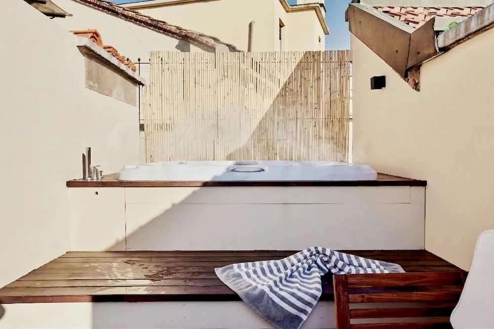 Private rooftop Jacuzzi above the Navigli skyline